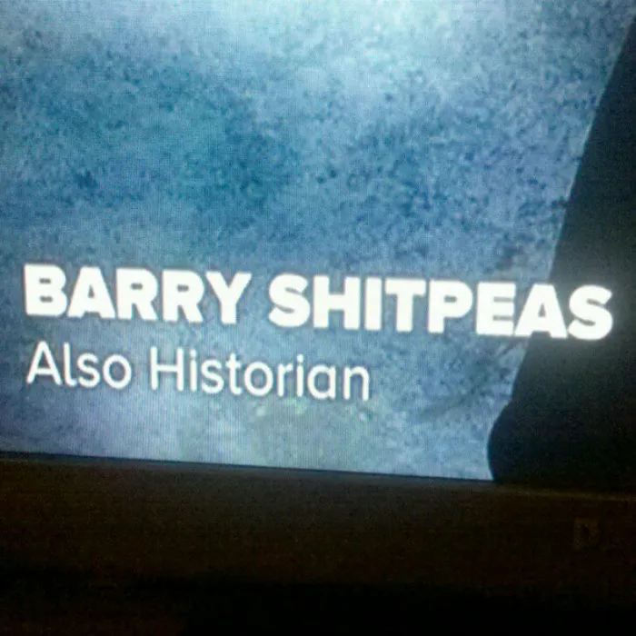 Text on screen displaying a funny name, Barry Shitpeas, labeled as an historian.
