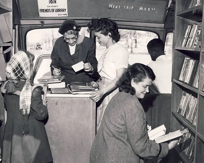 Carolyn Herntz Assists Patrons Visiting The Bookmobile, 1958