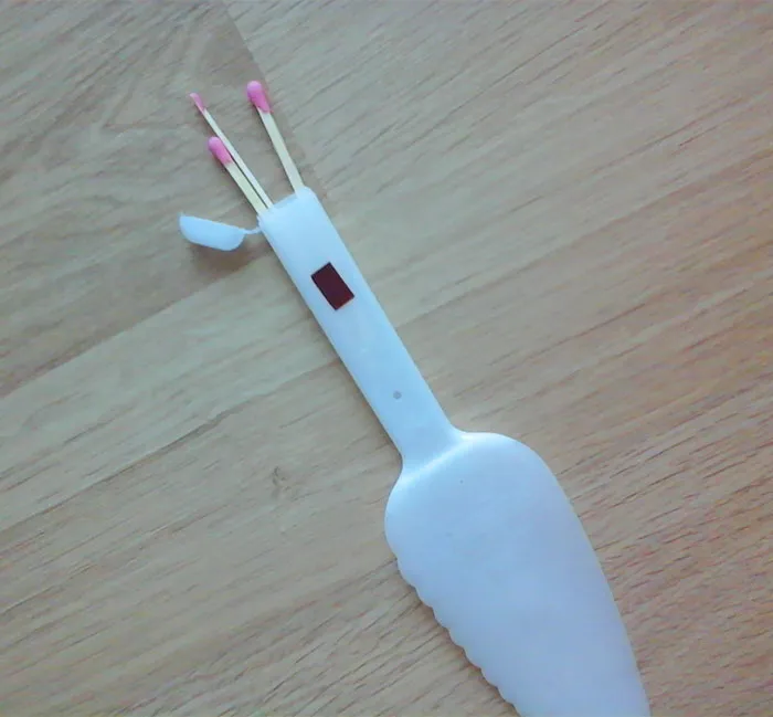cake knife with  a storage in the grip for matches