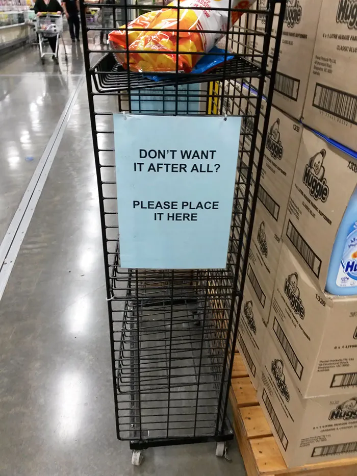 paper with information hanging on the shelf in the supermarket
