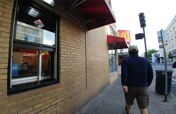 man going along the McDonalds