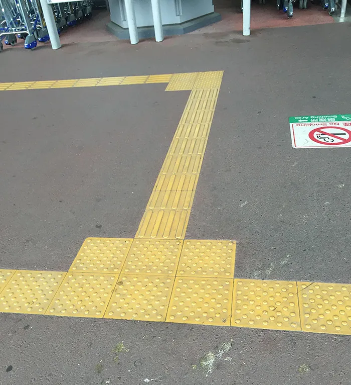 yellow paths on the ground for the blind 
