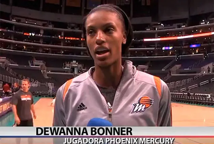Basketball player in a stadium being interviewed, related to funny names.