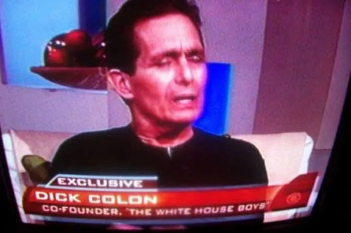 Man on TV interview with the funny name "Dick Colon" displayed as a co-founder, engaging in an exclusive discussion.