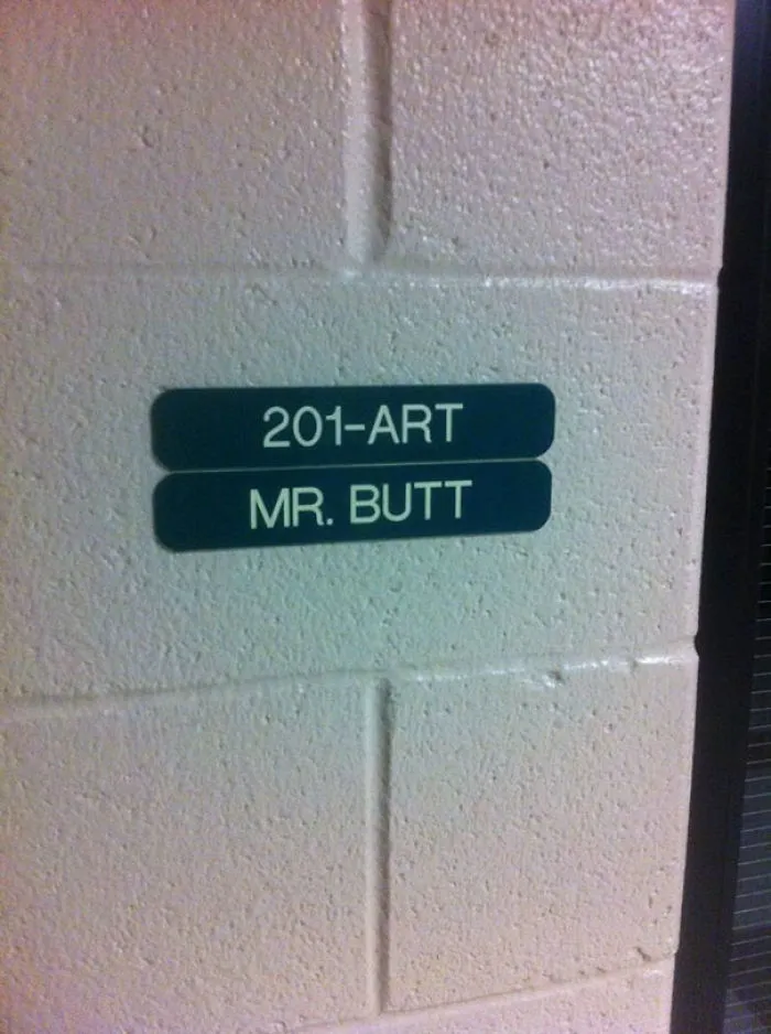 Room sign with the funny name "Mr. Butt" beneath "201-Art".
