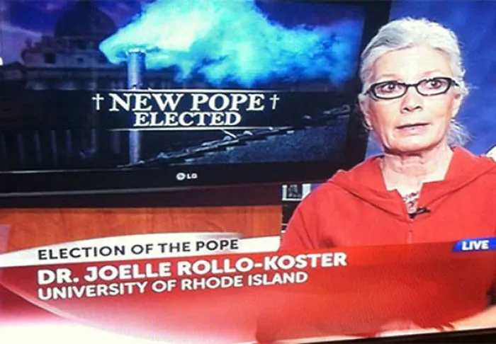 A TV broadcast humorously labels a professor as the new pope, referencing funny names.