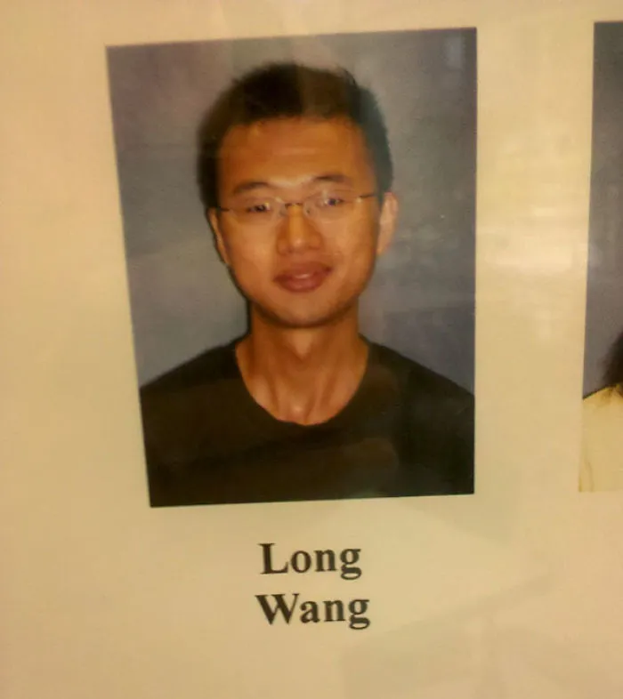 A man named Long Wang in a formal portrait, highlighting examples of funny names.