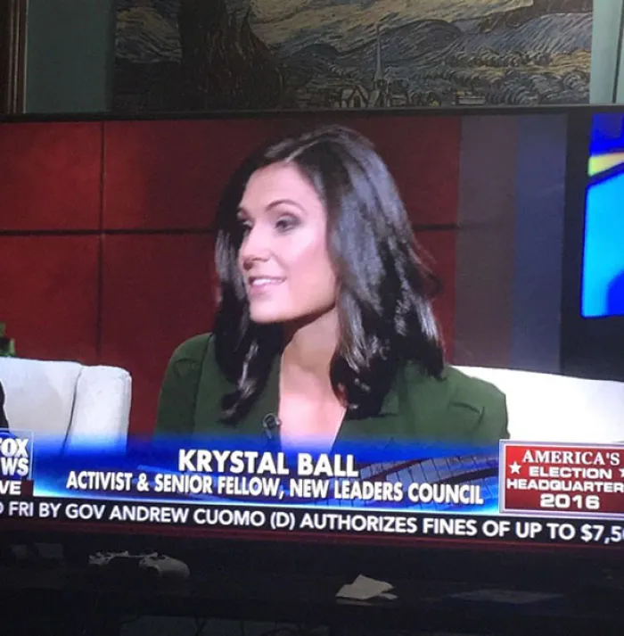 Person on a TV news segment labeled "Krystal Ball," featuring a name from funny names.