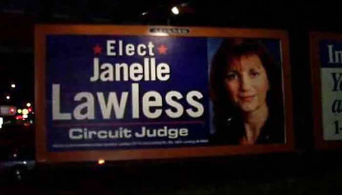 Billboard promoting Janelle Lawless for Circuit Judge, showcasing a funny name in an election campaign ad.