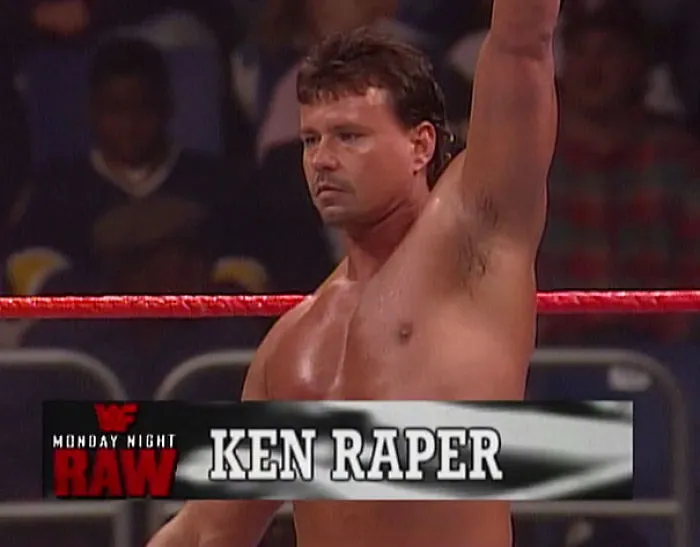 Wrestler in the ring with name banner displaying a funny name, highlighting humorous monikers.