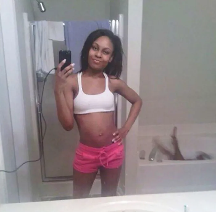 Woman taking mirror selfie 