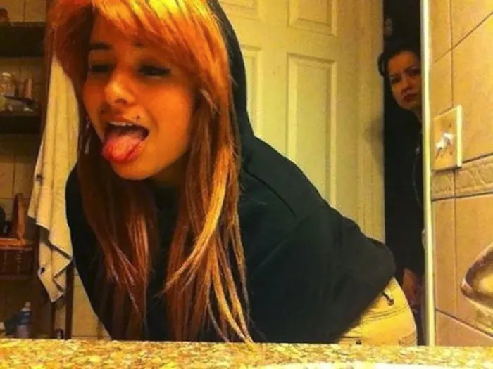 Girl taking mirror selfie 