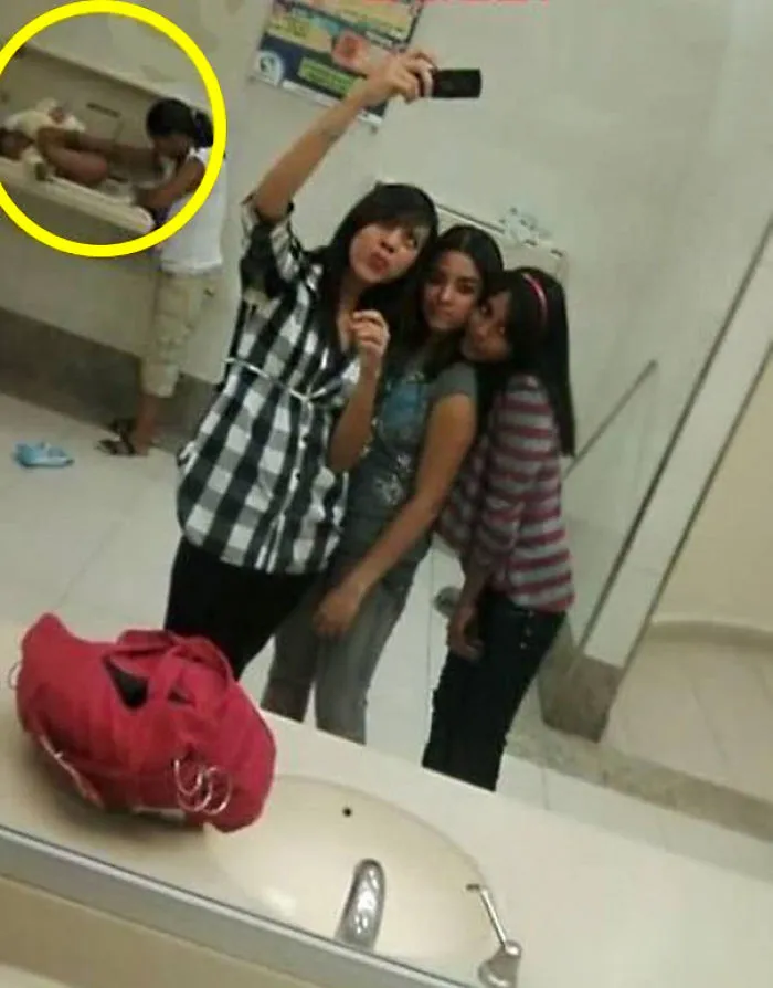 Friends taking mirror selfie 