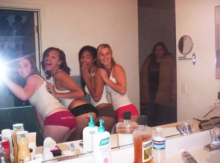 Friends taking mirror selfie 