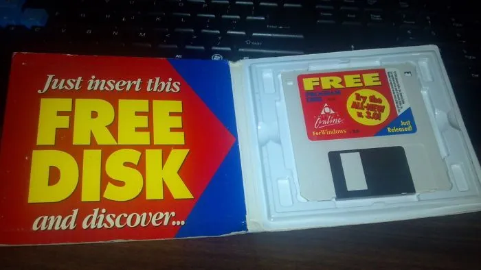 Floppy disk in a vintage package with "Just insert this free disk" text, illustrating older people struggling with technology.