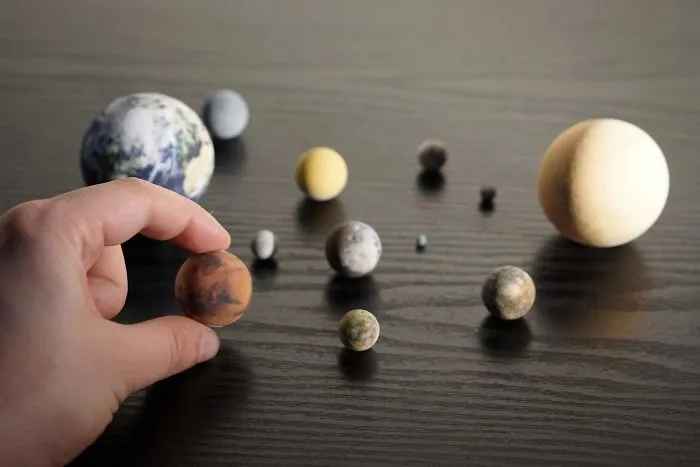 Earth, Venus, Mars, Mercury, 4 Large Moons Of Jupiter - Io, Europa, Ganymede, Callisto, The Earth's Moon, Titan, Triton, Pluto And Ceres