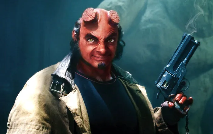 Photoshopped image of Mr. Bean's face on a demon character holding a smoking gun, showcasing hilarious edits.