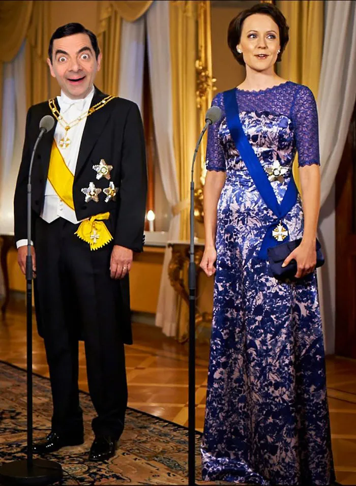 Mr. Bean photoshopped into a royal setting wearing formal attire with a humorous expression during a speech.