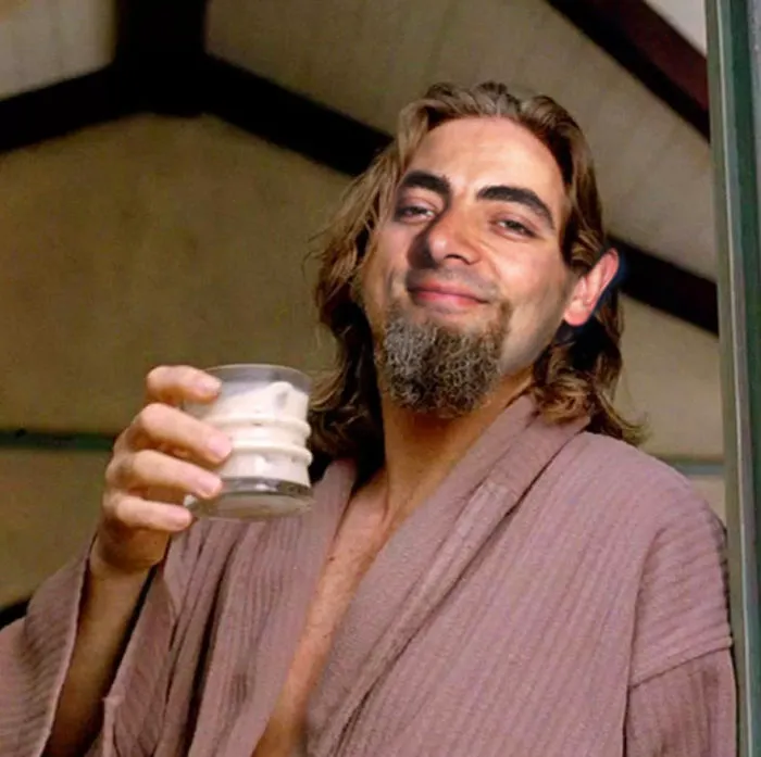 Man photoshopped with Mr. Bean's face, holding a drink and wearing a bathrobe, in a humorous edited scene.