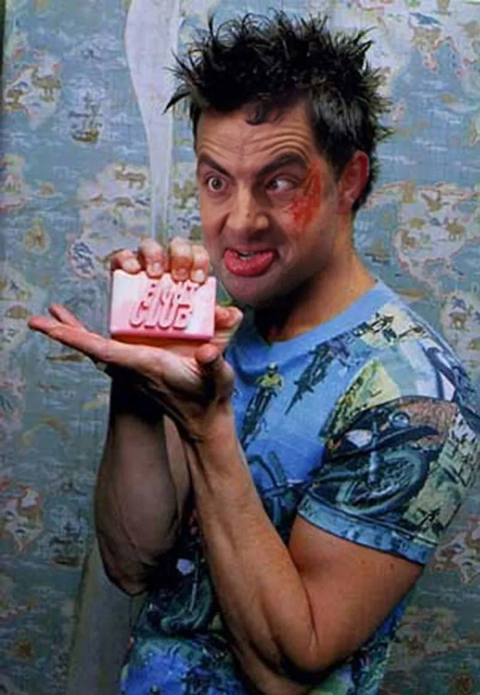 Man with Mr. Bean's face photoshopped holding pink soap, humorously edited as part of people photoshopping Mr. Bean into things.