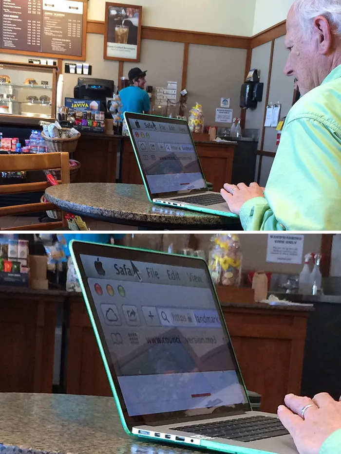 Older person using a laptop in a cafe with a magnified screen view, highlighting technology challenges.