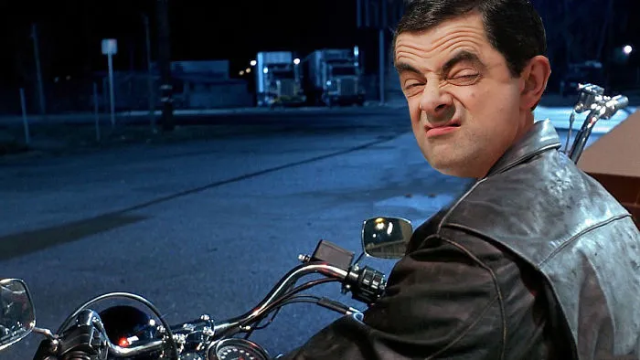 Mr. Bean photoshopped onto a motorcycle rider at night, creating a hilarious and unexpected scene.