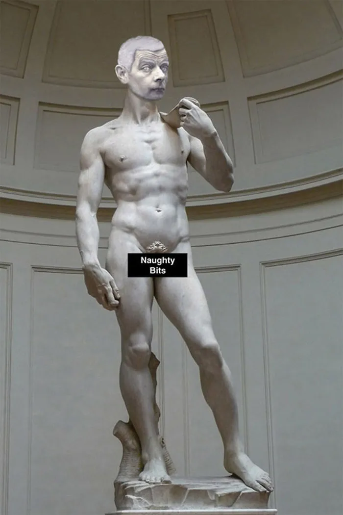 Classic statue with Mr. Bean's photoshopped head and a humorous censored label in a museum setting.