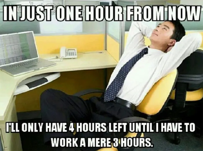 Man relaxing in office, embodying funny work meme sentiment.