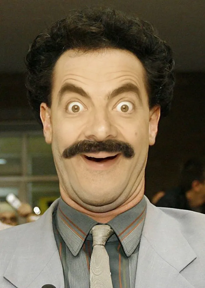 Close-up of a man photoshopped to look like Mr Bean with wide eyes and an excited expression.