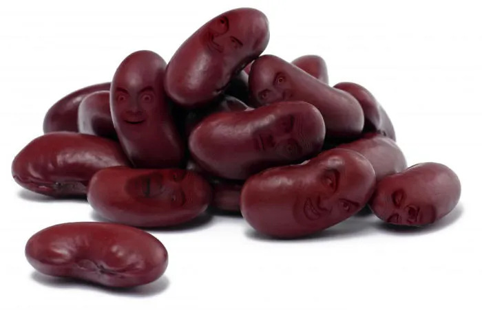 Photoshopped beans with Mr. Bean faces stacked together on a white background in a humorous composition.