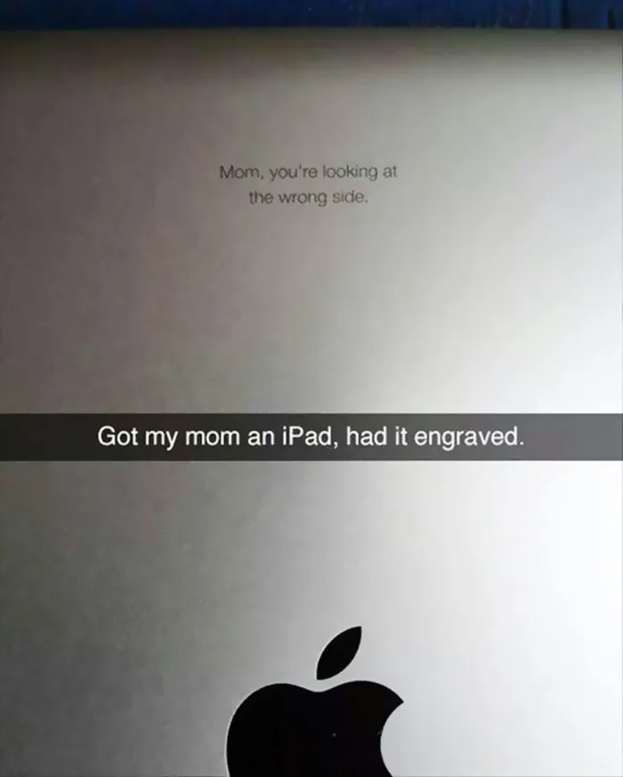 Engraved iPad with text, "Mom, you're looking at the wrong side," humor on older adults struggling with technology.