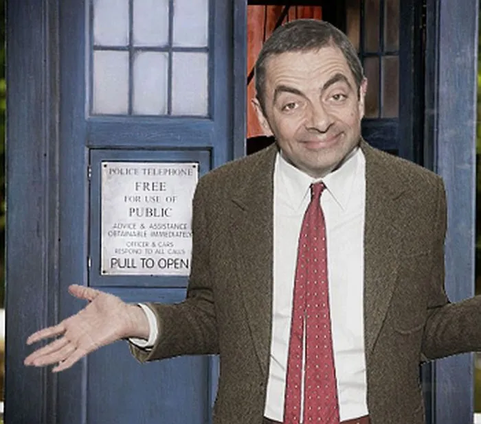 Mr. Bean photoshopped standing with arms outstretched in front of a blue police telephone box, smiling.