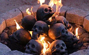 Terrifying Fireproof Human Skull Logs For Your Next Family Camping Trip