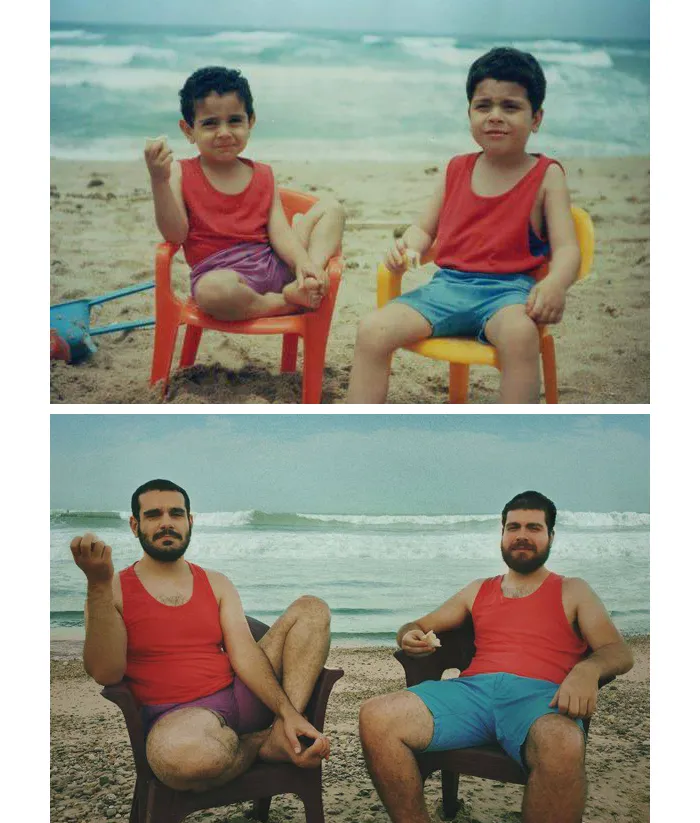 Two brothers sitting on beach chairs in matching red tops and shorts at the beach