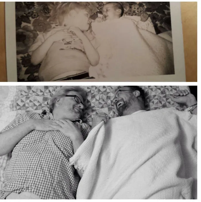 Two brothers laughing together laying in bed, recreating old photo