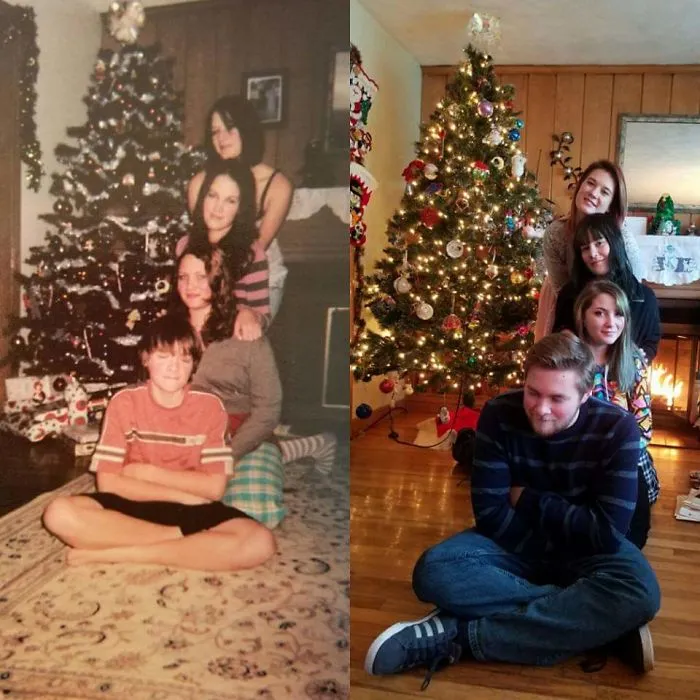 Family group stacked in front of decorated Christmas tree in recreated pose