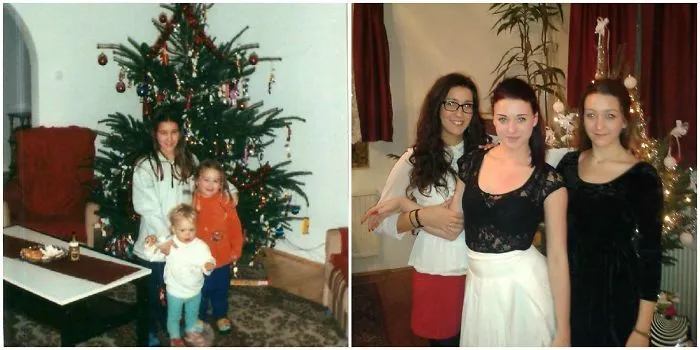 Siblings recreating childhood Christmas photo by decorated tree inside home