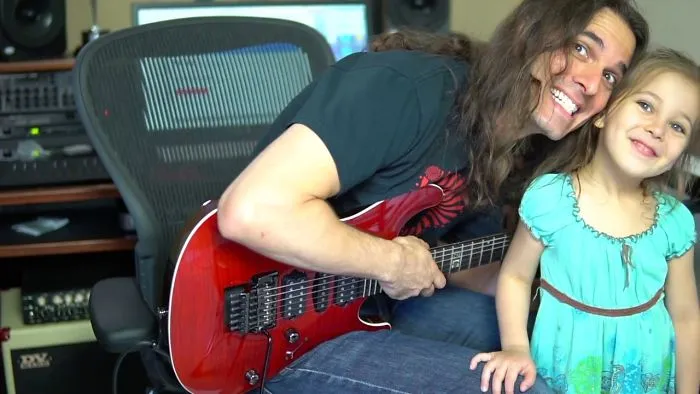 This Famous Guitarist Is Just Trying To Pratice, But His Daughter Wants Attention! Cute!