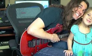 This Famous Guitarist Is Just Trying To Pratice, But His Daughter Wants Attention! Cute!