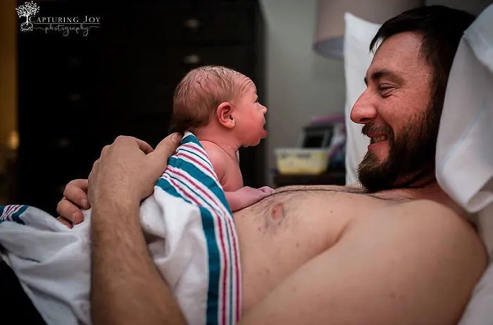 Wow. Hours Old And Already Lifting Her Head Up High To Get A Good Look At Her Daddy!