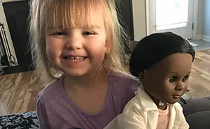 After Cashier Asks 2-Year-Old Girl If She Wants Doll That Looks 'More Like Her,' Toddler Brilliantly Shuts Her Down