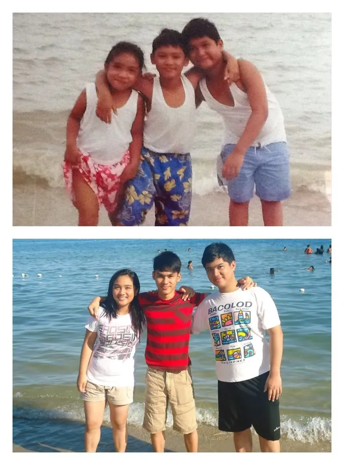 Three siblings posing on the beach with arms around each other recreating a childhood photo