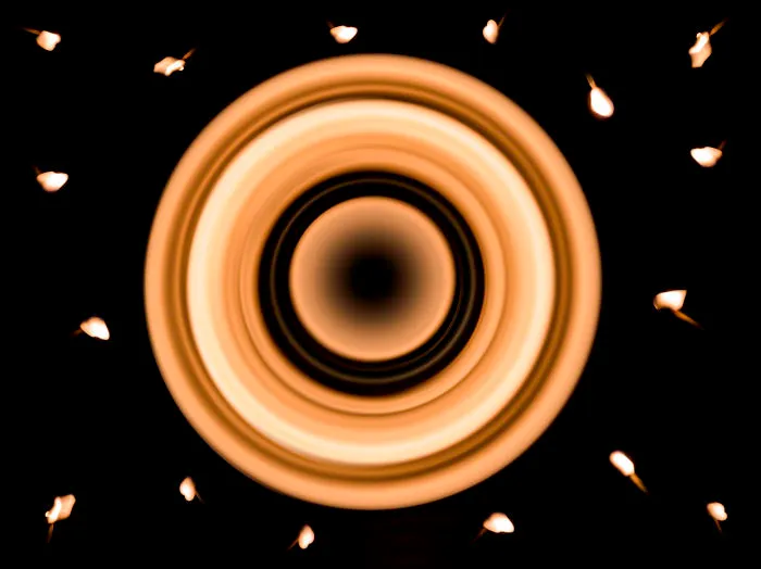 I Created A Photo Of Saturn And Stars Using Only Matches, Sticky-Tack, And A Crystal Ball