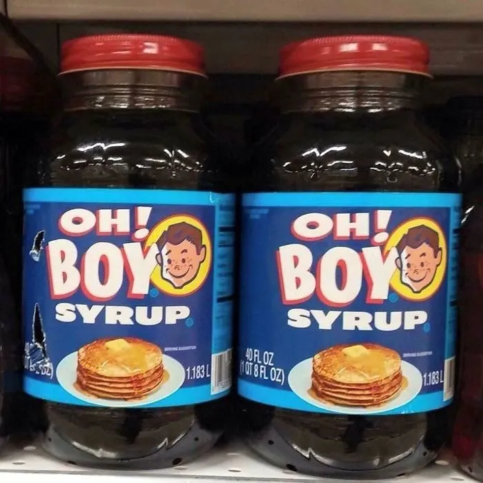 Two jars of syrup labeled "Oh! Boy Syrup" with pancake image, illustrating a humorous design fail.