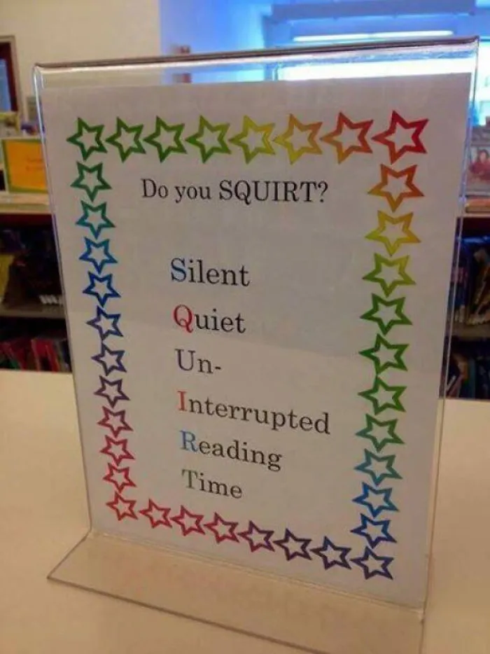 Sign with "Do you SQUIRT?" and acronym for Silent, Quiet, Un-Interrupted Reading Time, showcasing funniest design fails.