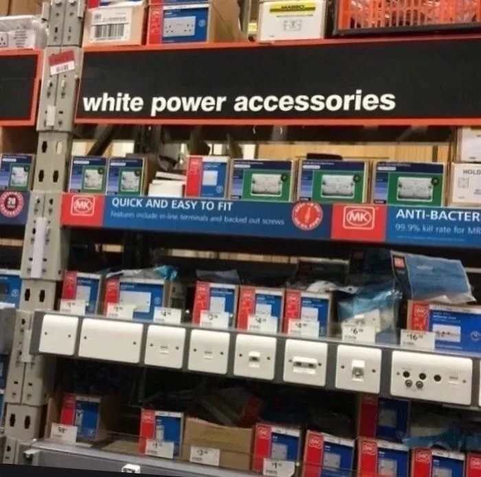 Shop shelf with funny design fail sign reading "white power accessories" above electrical products.