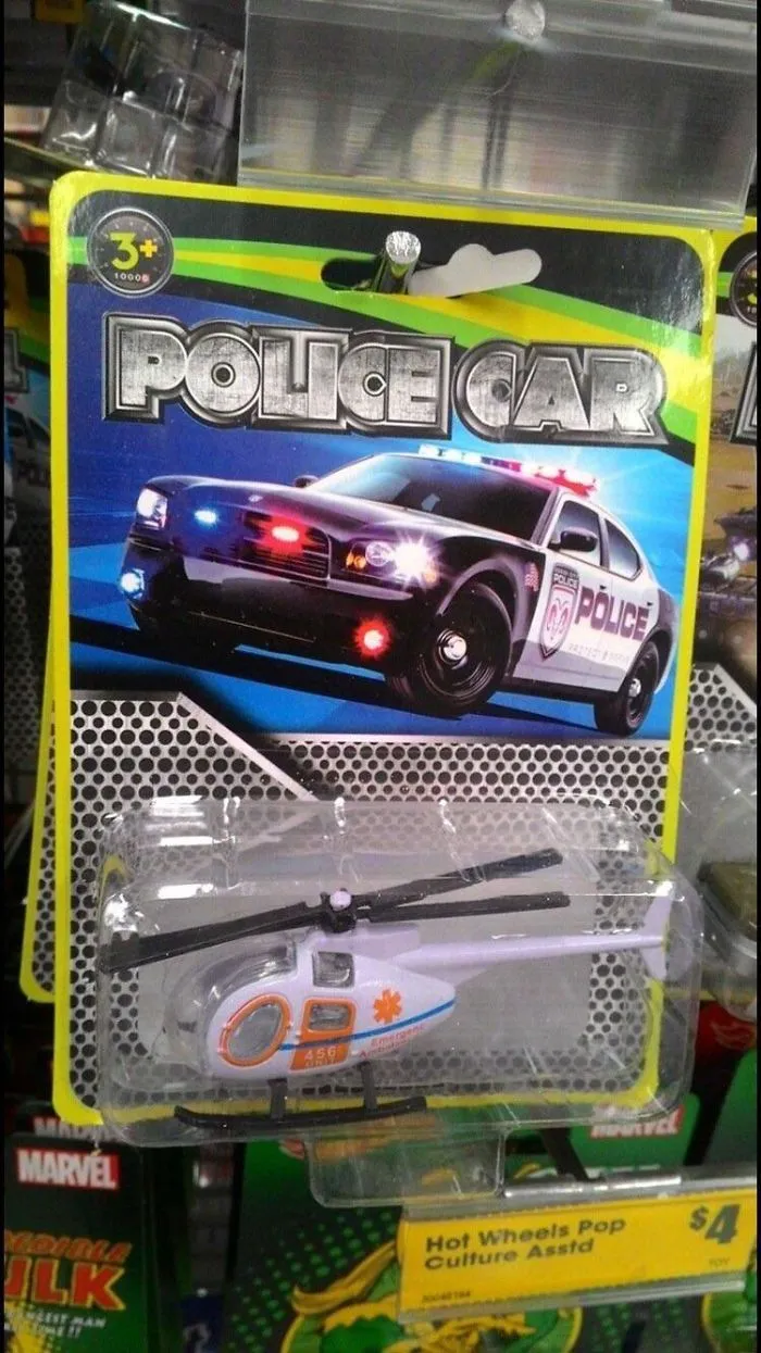 Toy packaging labeled "Police Car" with a helicopter inside, illustrating a funny design fail in product presentation.