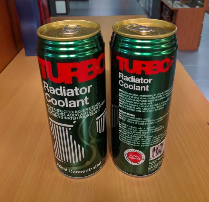 Cans labeled "Turbo Radiator Coolant" resemble energy drinks, showcasing a humorous design fail.