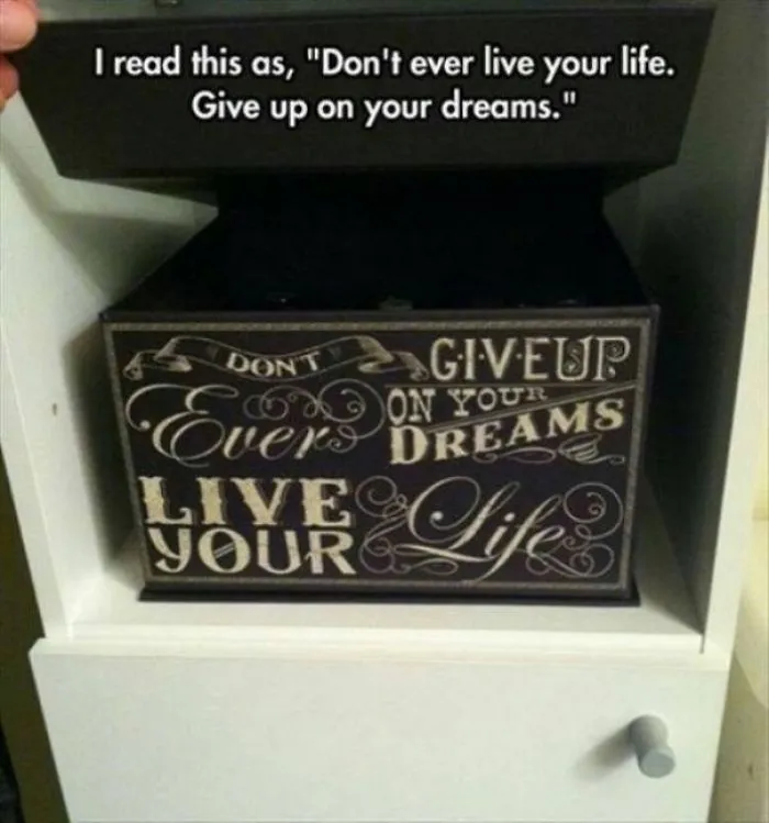 Decorative box with confusing design, banner text says, "Don't ever give up on your dreams. Live your life." Label reads opposite.