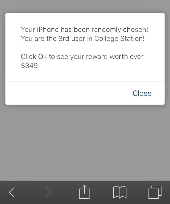 Pop-up message on iPhone screen claims random selection, offering a $349 reward; an example of a design fail.